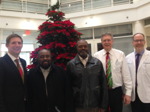 Wiley Bridgeman and Kwami Ajamu with the staff at Cleveland Eye Clinic