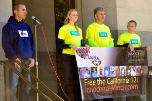 Exoneree Uriah Courtney with CIP Attorneys Alissa Bjerkhoel, Justin Brooks, and Michael Semanchik